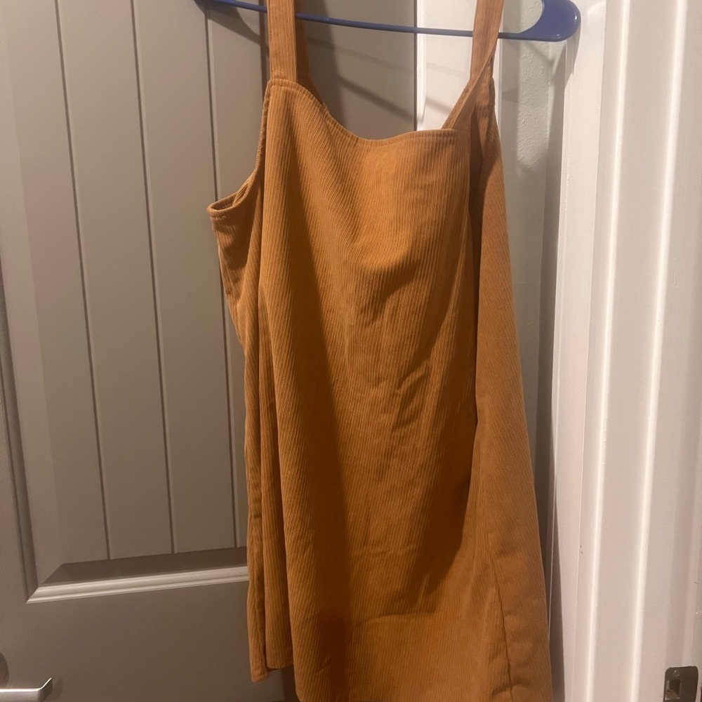Radiant brown Square Neck Sleeveless dress. Looks super cute with a long sleeve